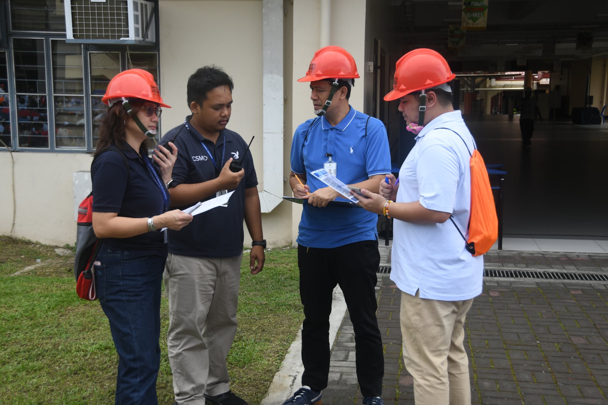 (L–R) Czel Lacson, ASHS Assistant Principal for Administration & ASHS Local Unit Emergency Response Teams (LUERT) Head; Eduard Pascual, Campus Safety and Mobility Office (CSMO) Security Affairs Officer for High School; Alex Manuel, LUERT and Students’ Headcount Point Person; and Porfirio Zablan, LUERT–Intelligence.