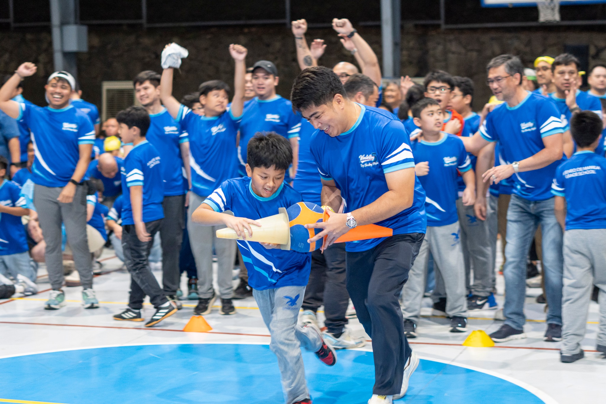 A relay game becomes an exercise in teamwork and encouragement