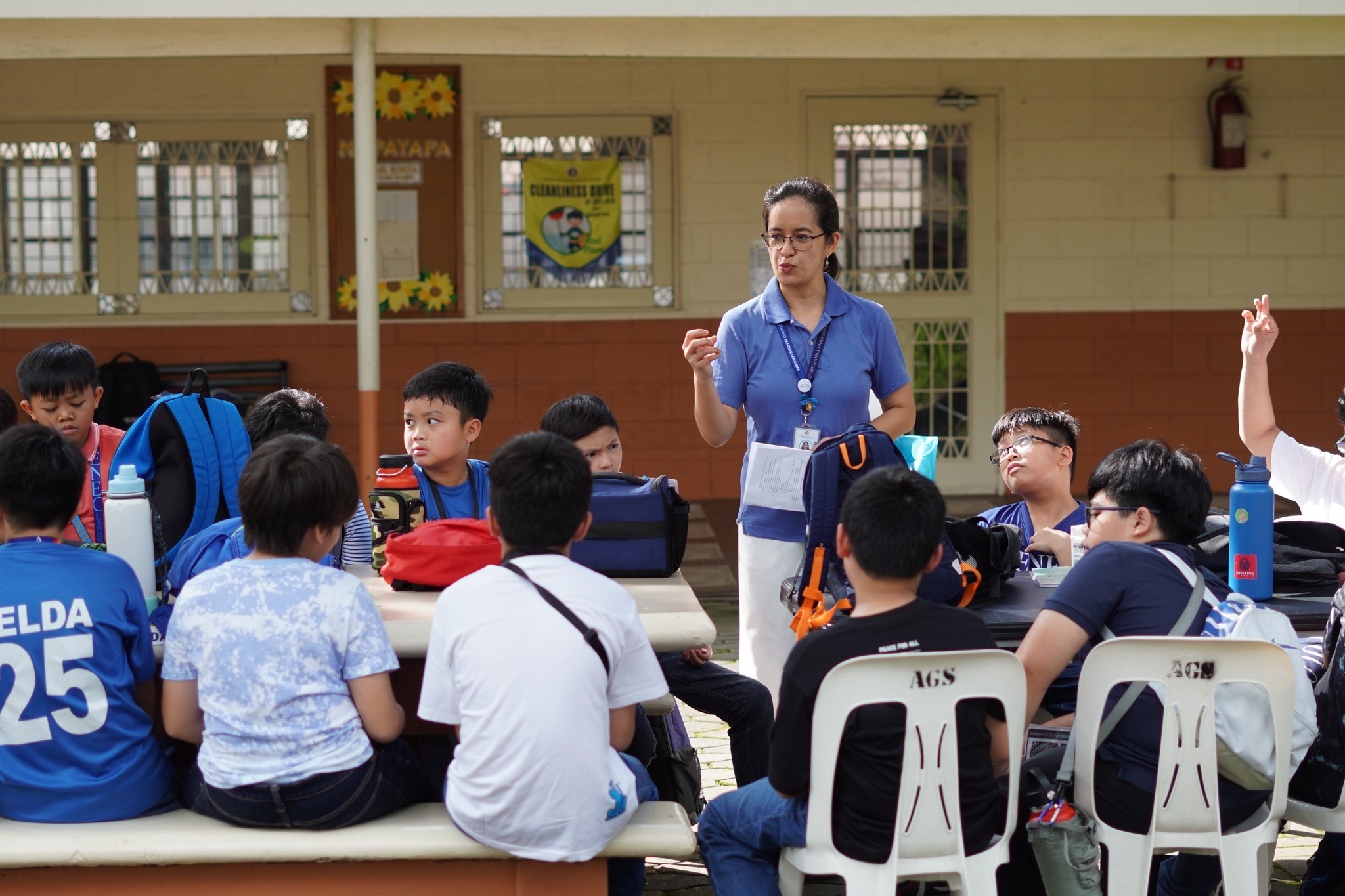 The teacher-facilitator deepens the participants’ experience during the baptism relay game.