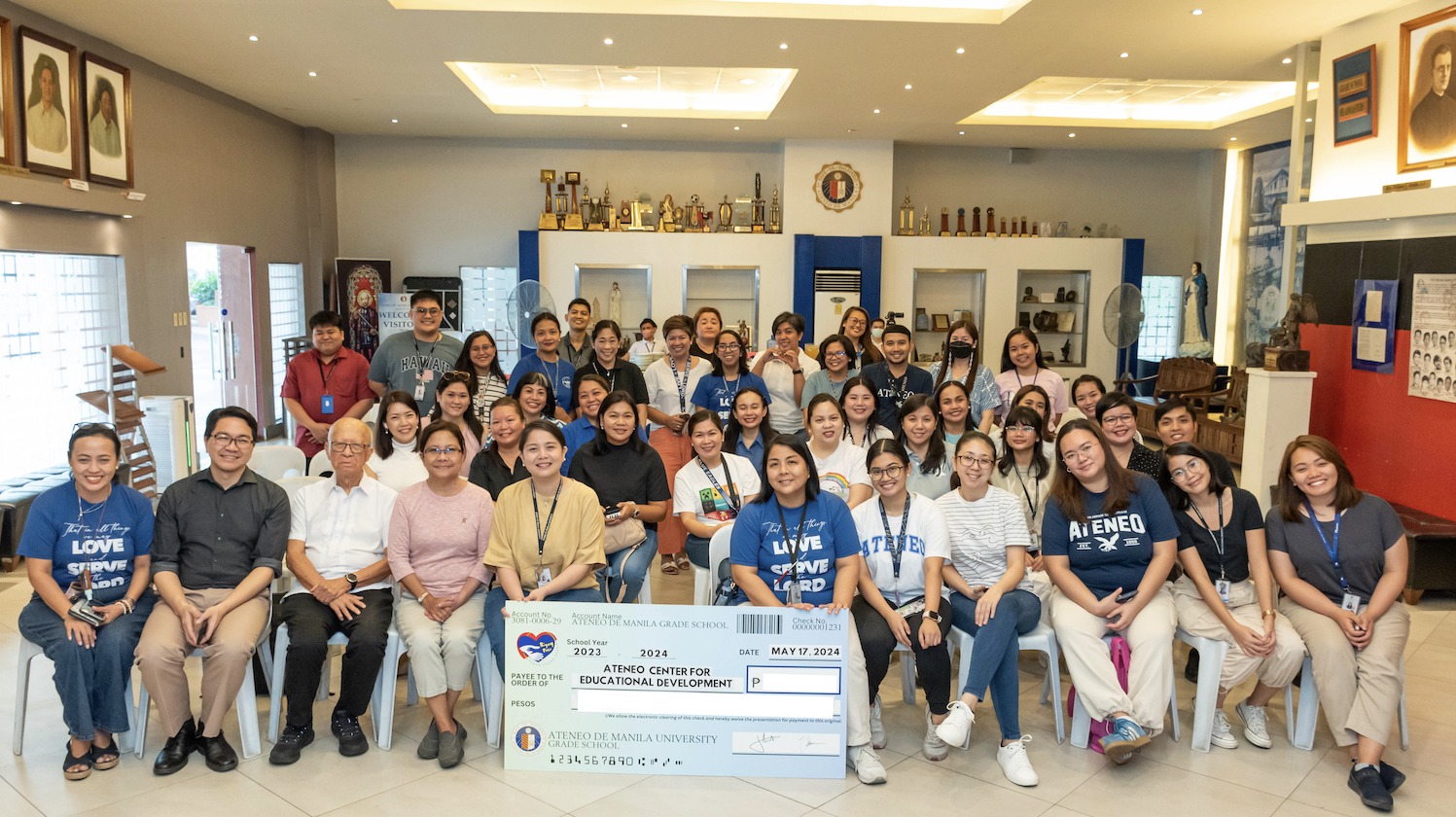 The Grade 2 family shares a blessing with friends from Raymundo Punongbayan Elementary School