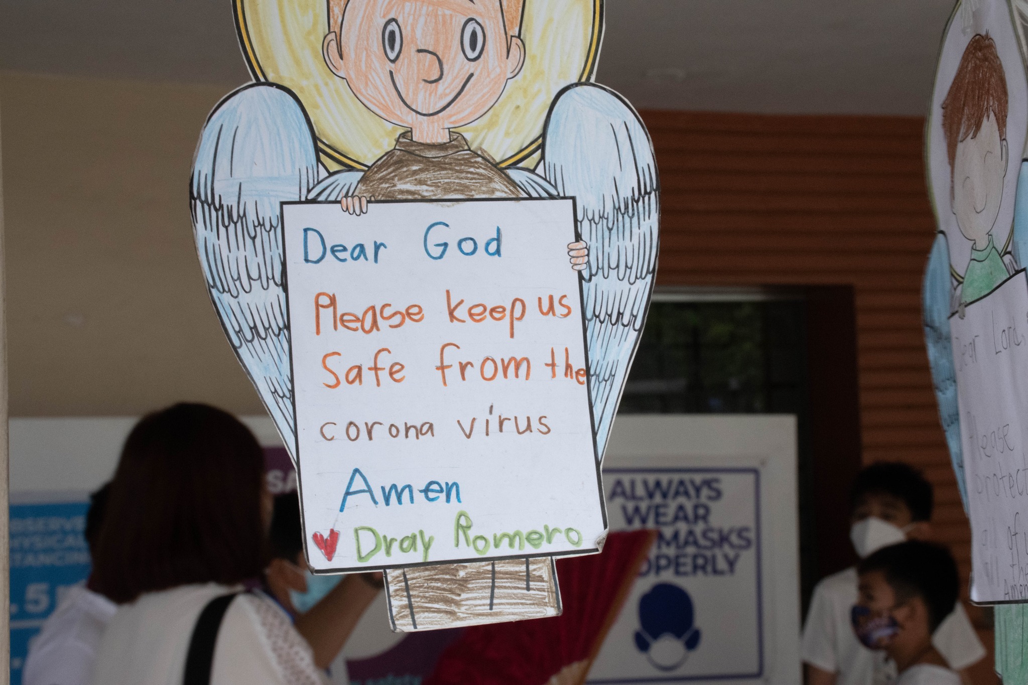 This cardboard cutout of an angel includes the prayer of its grade 5 creator   