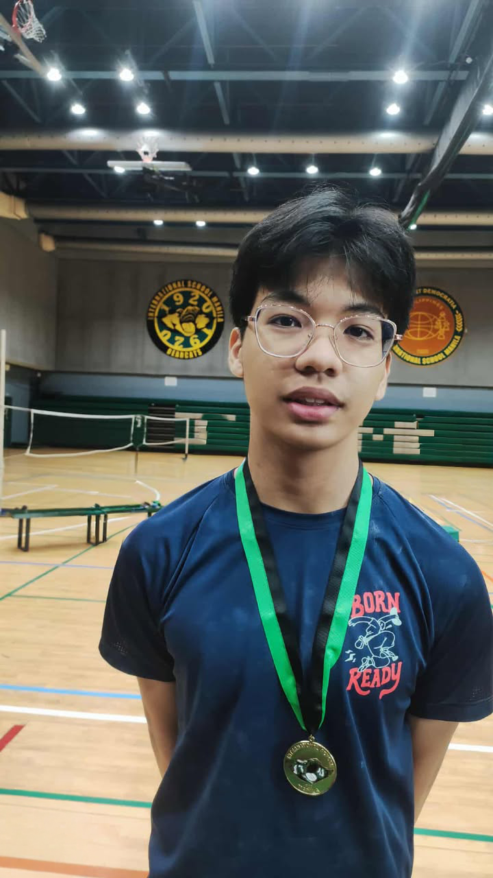 Cy Blanca proudly wearing his gold medal from the ISM Bouldering Competition