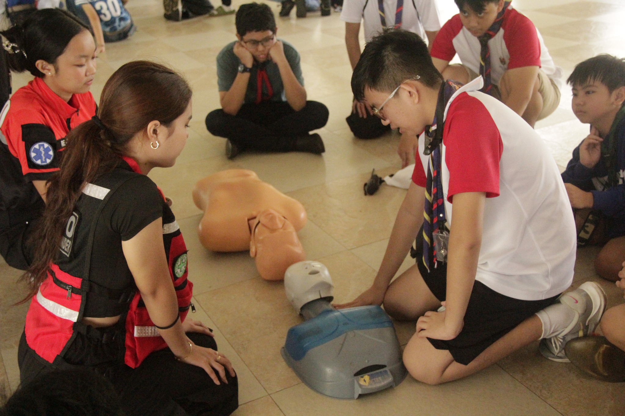 An Ateneo de Manila Scout learning CPR