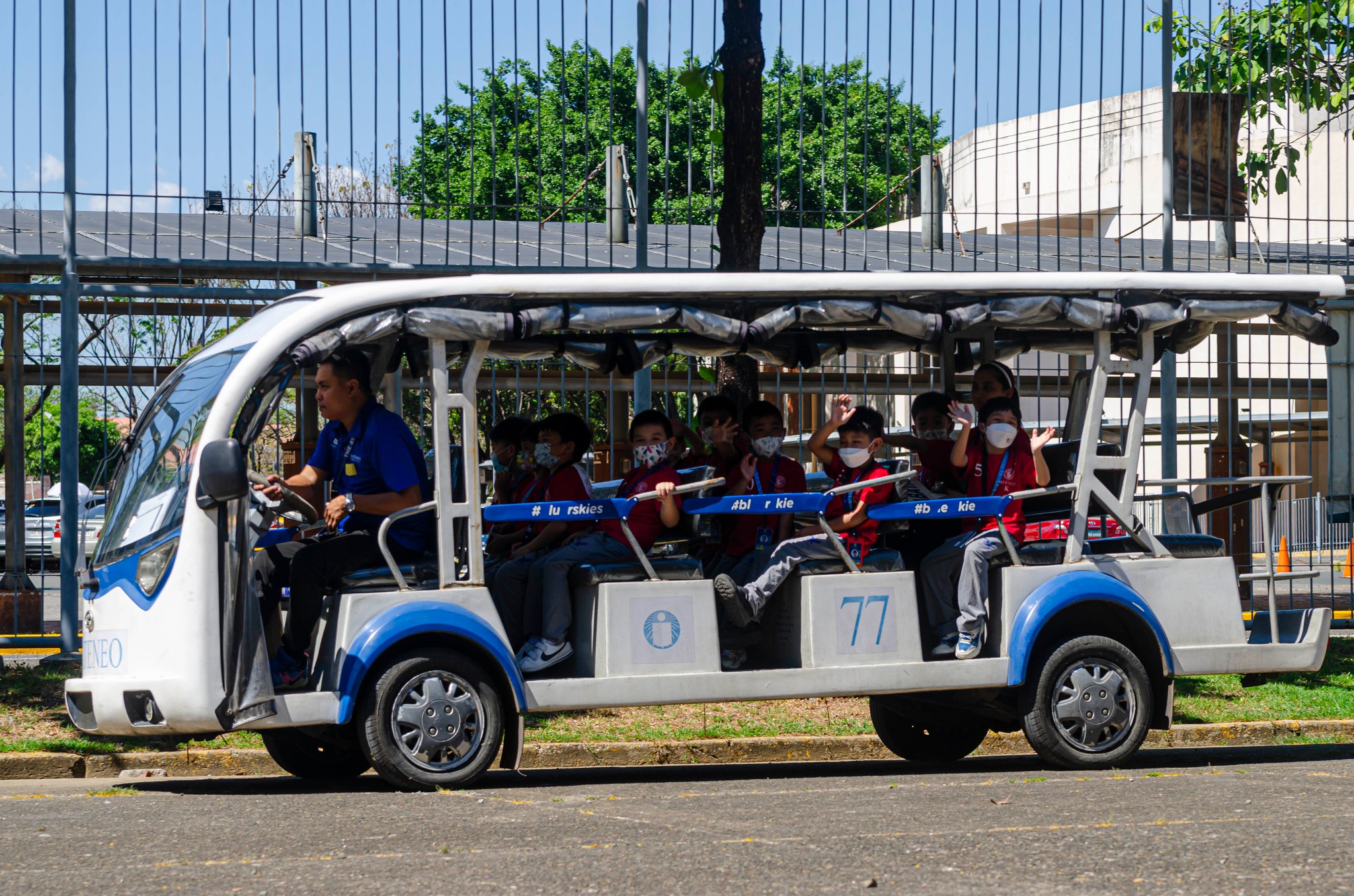 Kinder students riding the e-jeep for the first time