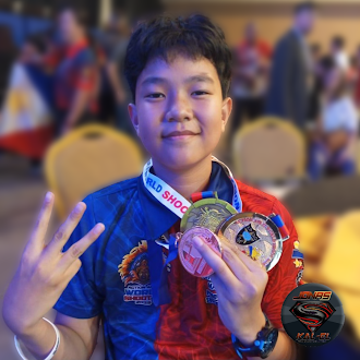 Ka-el Manalo poses with his three medals from Action Air II World Shoot 2025  