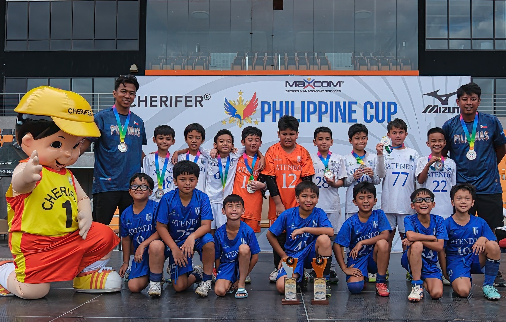 Front row sitting from left: Matteo Bartolome, Matti Verzosa, Jace Go, Jaime Gabasa, Jericho Quierrez, Latif Moti, Dustin Ramos; standing from left: Coach Rafael Cruz, Luke Tadeo, Ethan San Diego, Sid Leal, Edward Superable, Thomas Tan, Marcus Bonto, Jacob Monsanto, Patrick Tiotuyco, Felipe Montemayor, Coach Paul Madrona