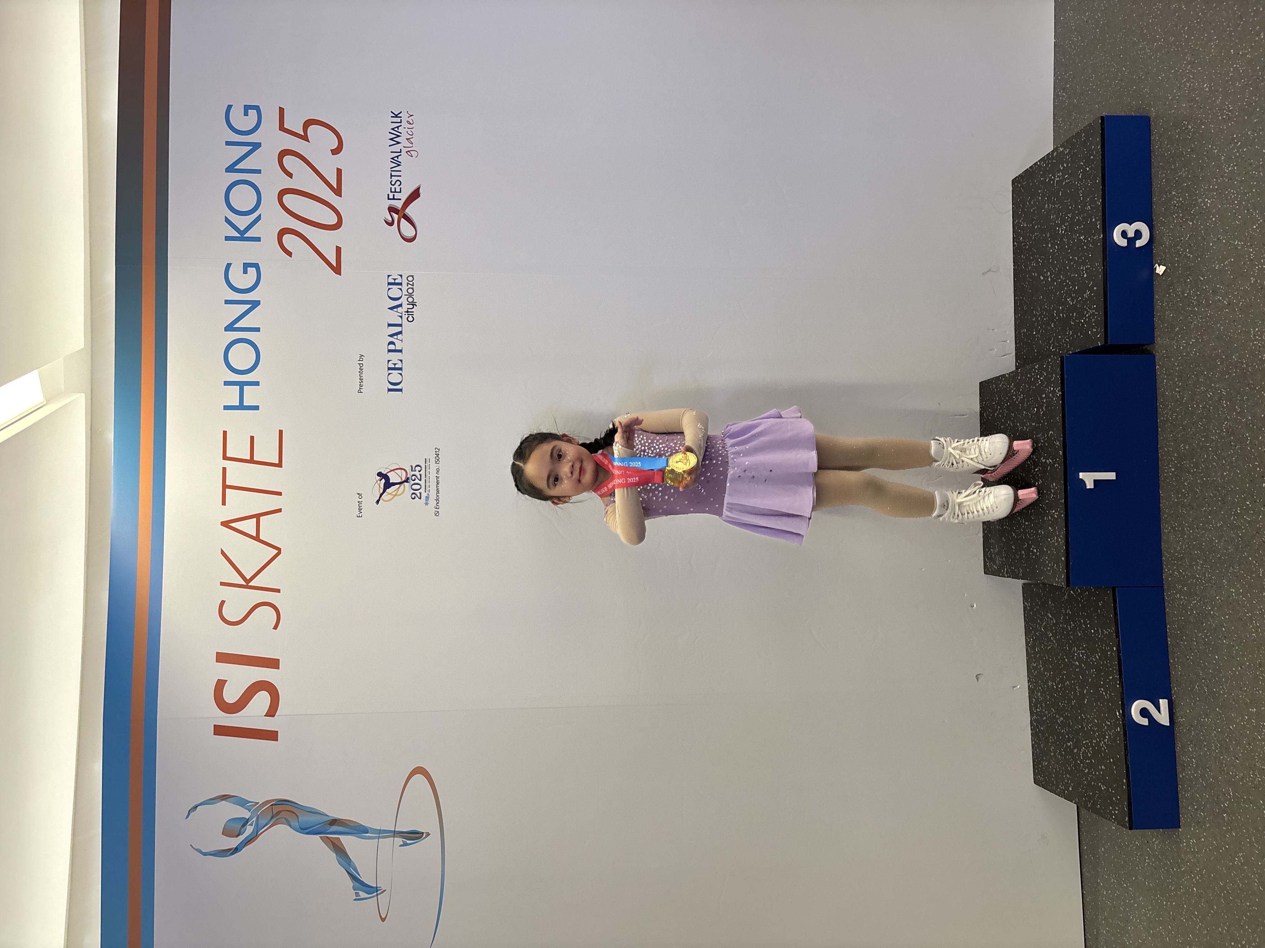 Alex wearing her two medals 