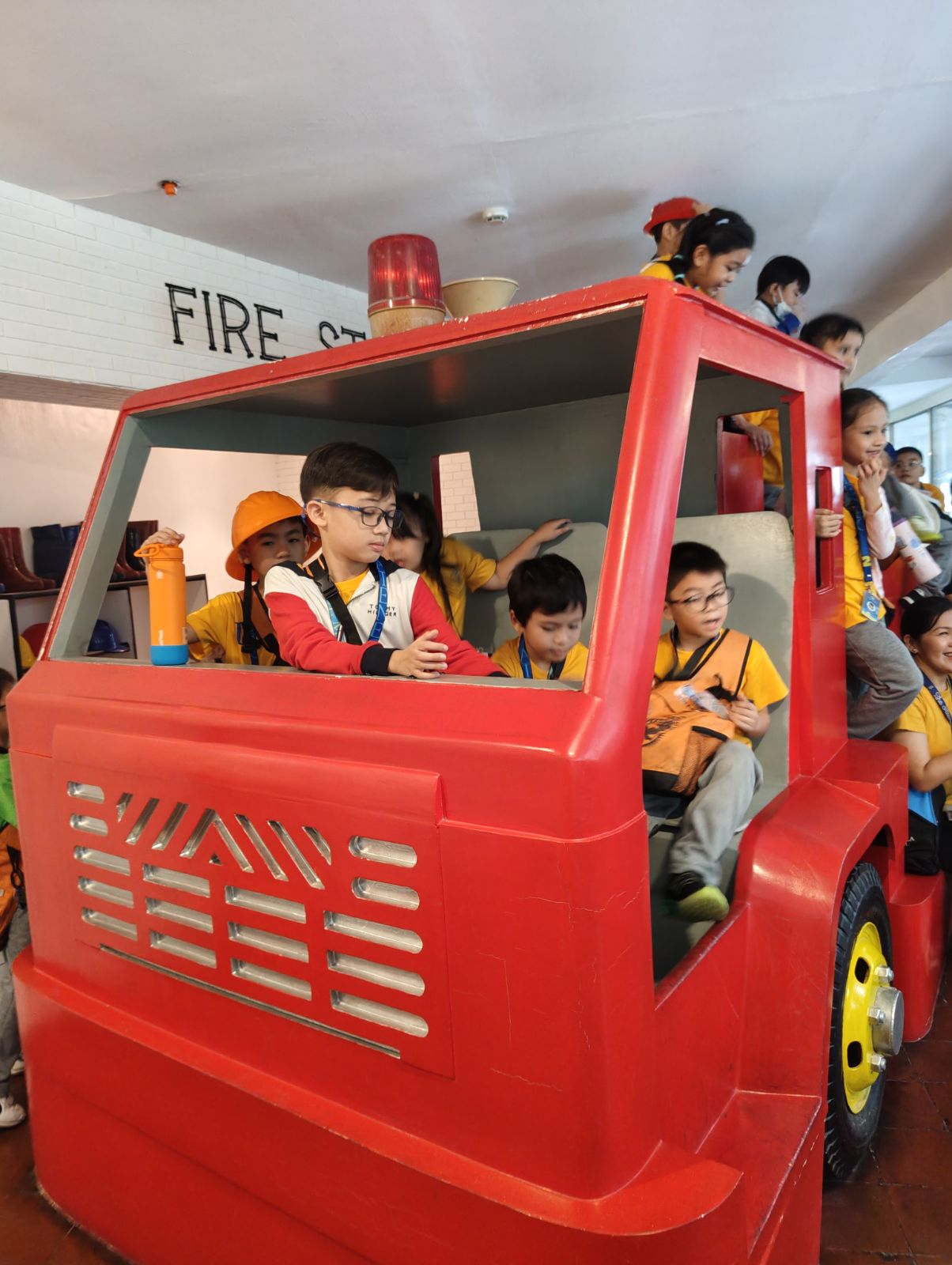 The Grade 2 Duhat class climbed onto the fire truck exhibit during their visit to Museo Pambata.