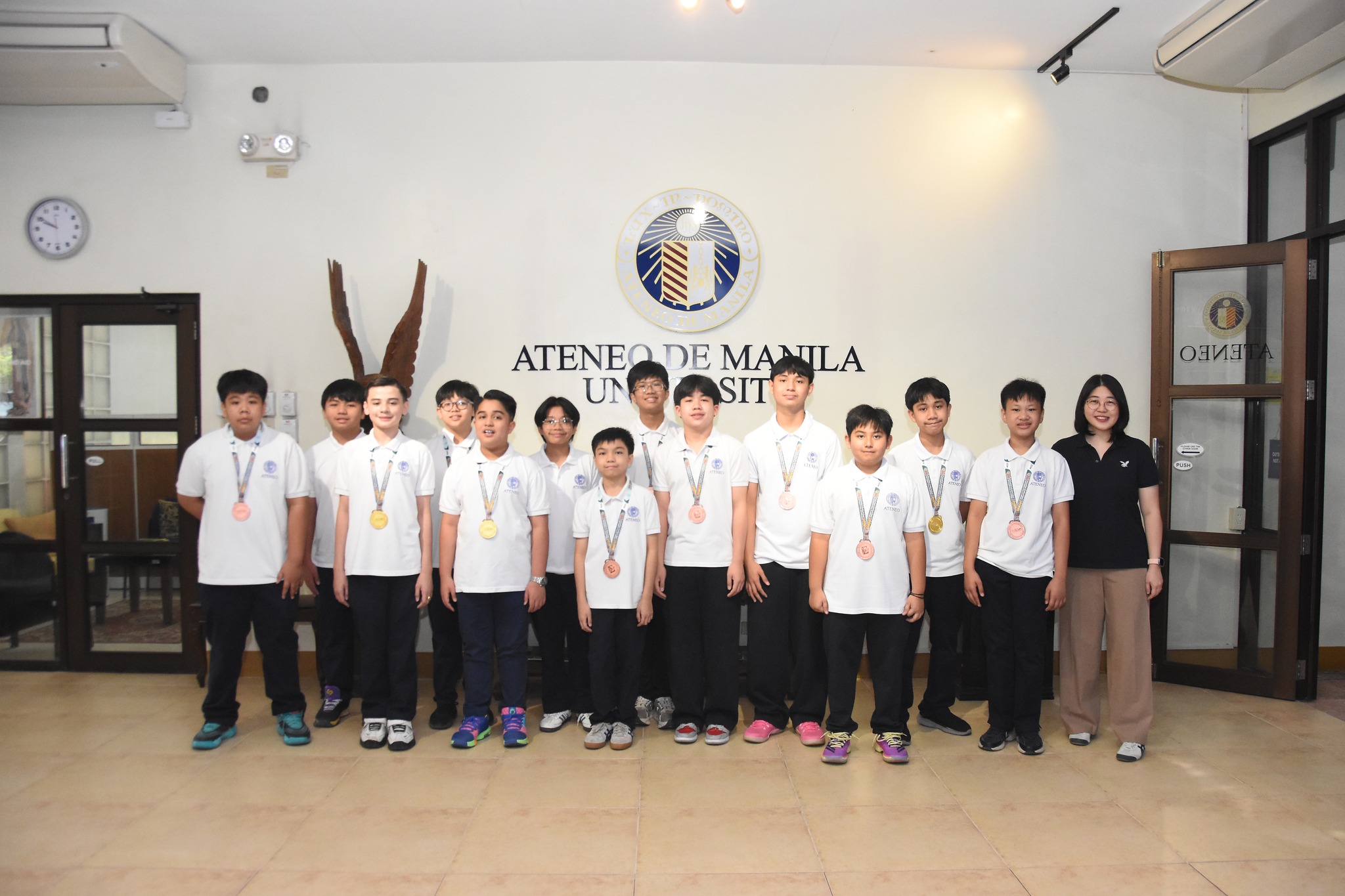 From left: AK Telan, Rav Vergara, Hunter White, Lucas Sy, Arvie Gelbolingo, Austin Saulong, Zack Copuyoc, Matty Trinidad, Lucas Clariza, Kygel Pasco, Marcus Salom, Mateo Palitog, Russ de Belen, Erika San Jose (Asst Principal for Academics)  