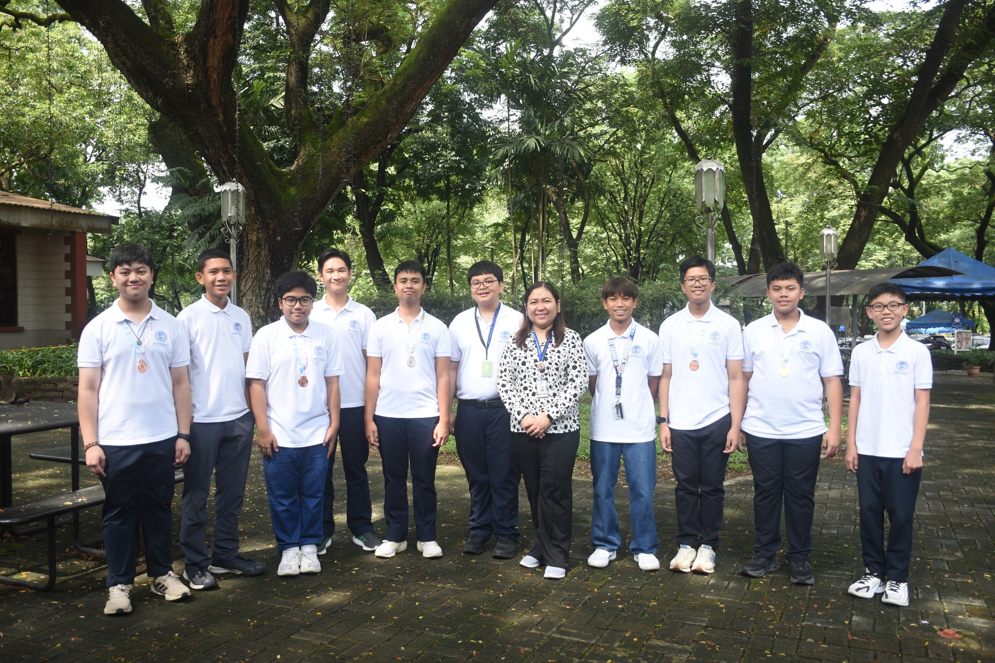 From left: Gab Asuncion, Karl Bilog, Thomas Camacho, Elijah Diaz, Gerrico Argonza, Koko Dela Cruz, Mrs Gen Sanvictores (AJHS Principal), Joshua Gonzalez, Matty Trinidad, Xavvi Lopez, Paco Javier  