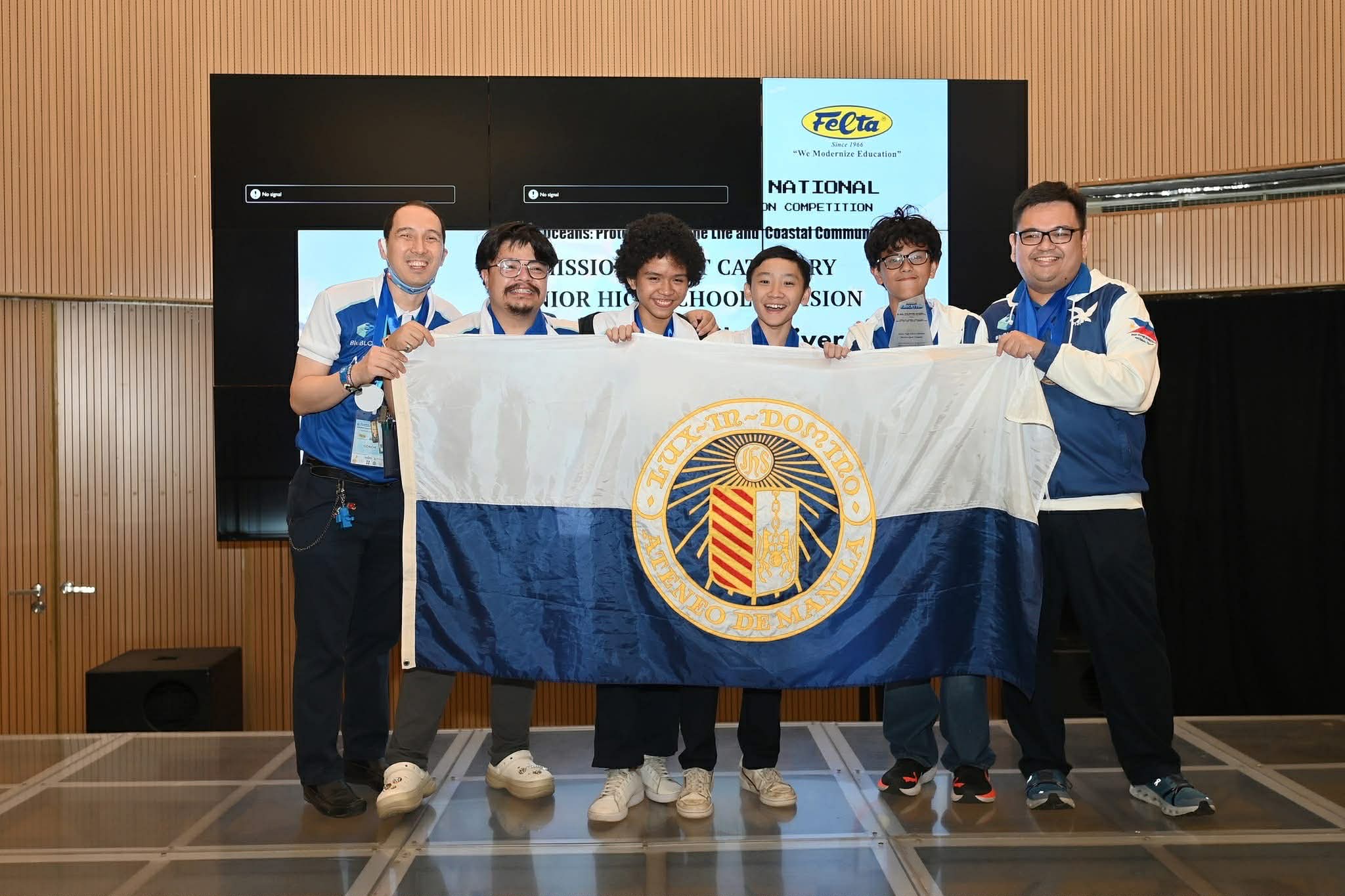 BluBLOC Coaches pose with JHS Mission Quest 2nd Placers Enrique Jambalos, Joaquin Reyes, Xian Palisoc