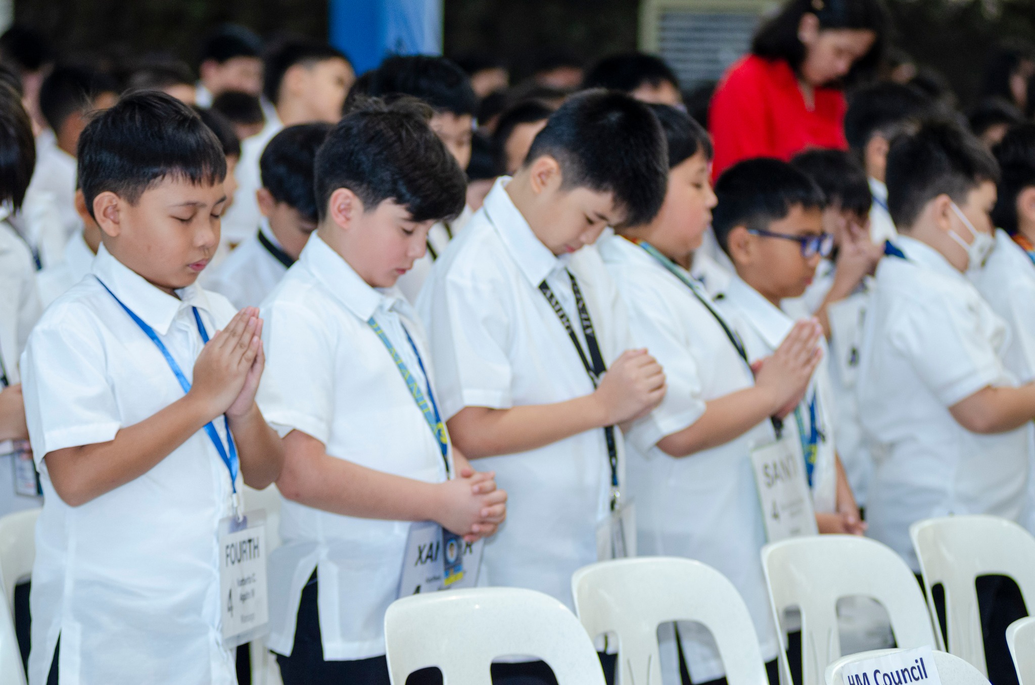 Students praying for their teachers