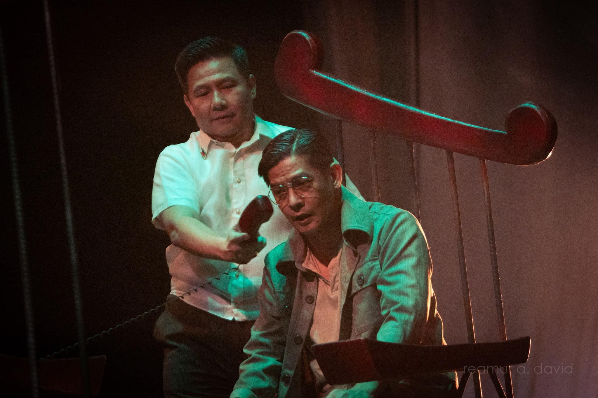 Ron Capinding as President Ferdinand Marcos Sr with Romnick Sarmenta as Benigno Aquino Jr in a scene from "The Impossible Dream"