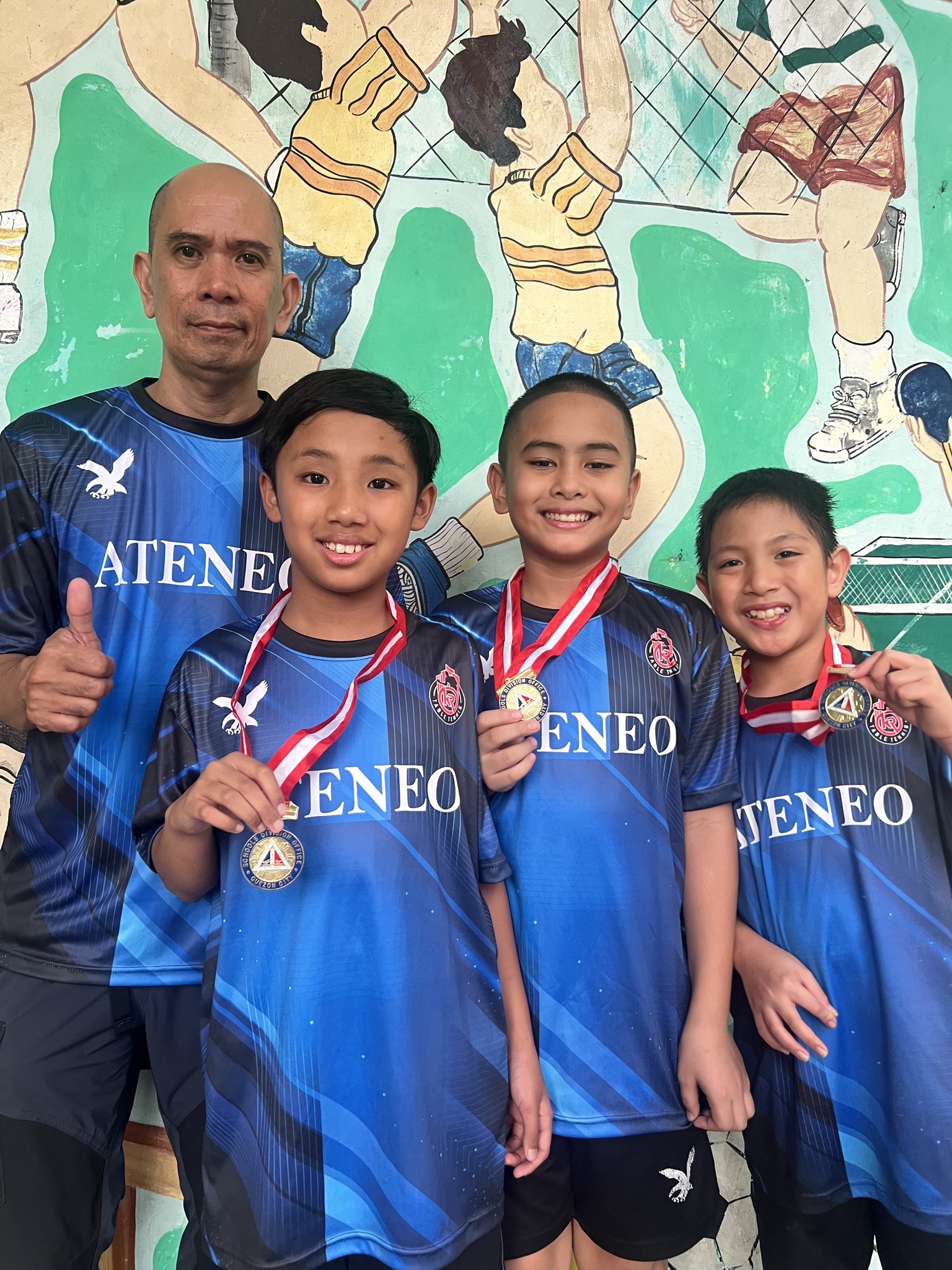 (L–R) Coach Leo Raymundo, Philo Go, Titus Pachica, and Karl Guanio will represent Quezon City as part of the NCR Table Tennis Team at the 2026 Palarong Pambansa.