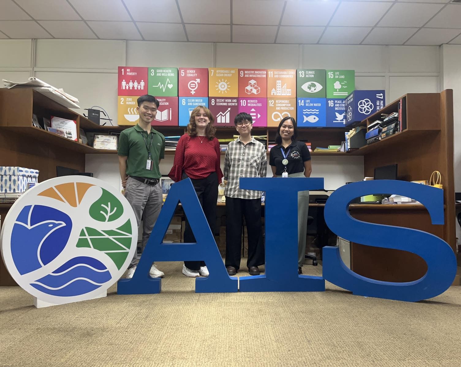 Ms Alyssa Kemp with members of the AIS team