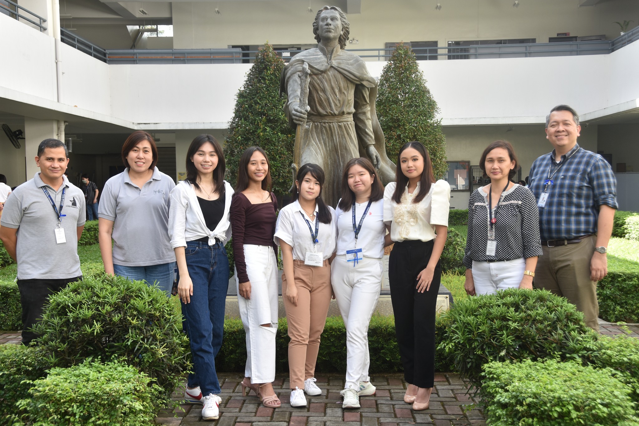 (L-R) Assistant Principal for Academics Javy Fabello, Assistant Principal for Formation Jen Concepcion, Aliah Garcia, Aliyah Herlihy, Ira Concepcion, Eliana Lim, Daniella Barbacena, Assistant Principal for Administration Czel Lacson, Principal Noel Miranda