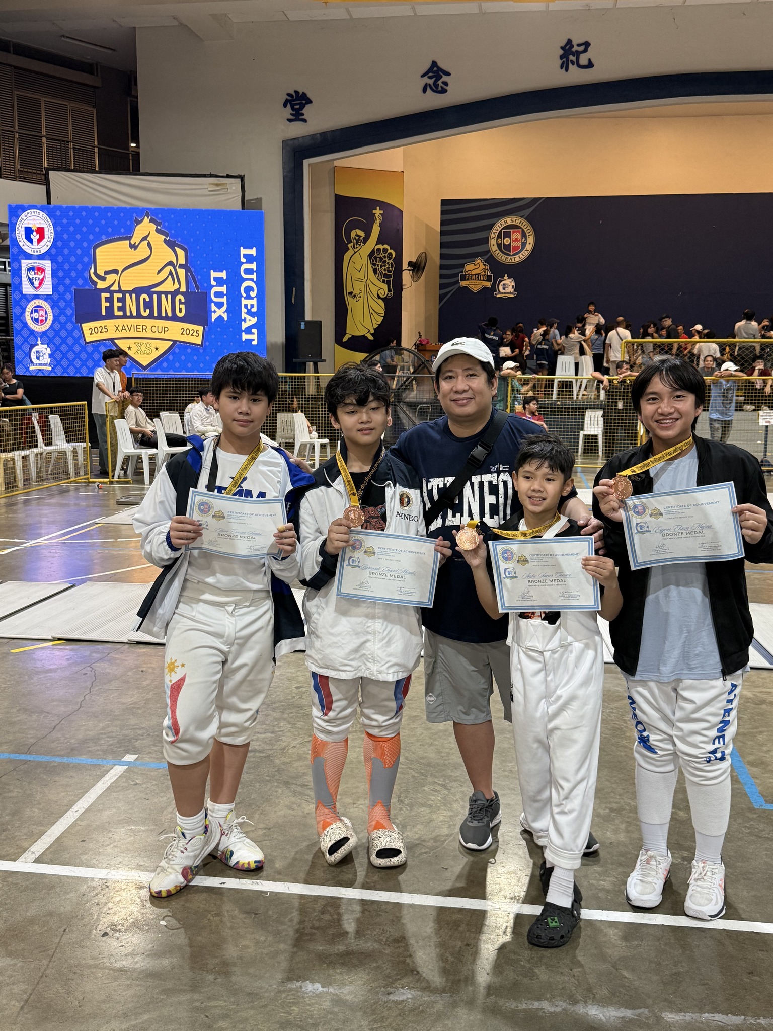 From left: Ethan Santos, Bear Morales, Coach Edward Daliva, Xavier Tanseco and Eliam Mojica