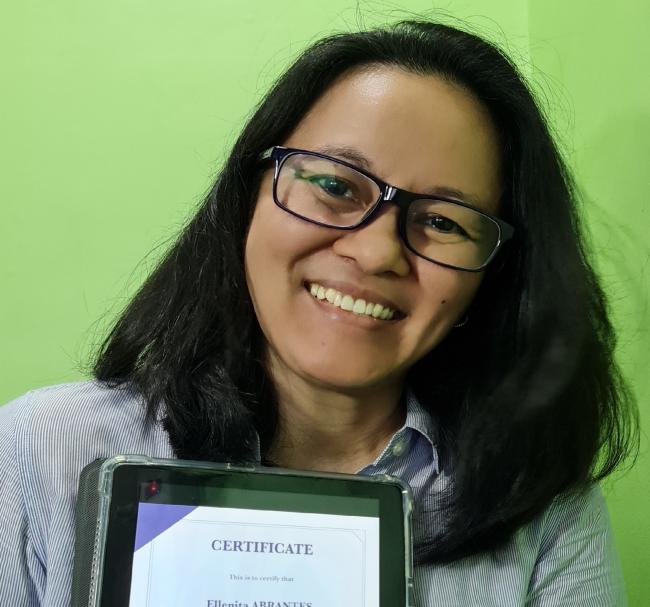 Abrantes with her certificate of completion 