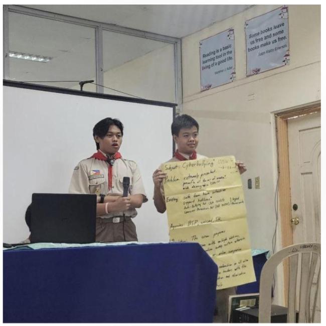 Scouts Troy Macaraeg and Gab Magabo discuss cyberbullying during their SPEAR presentation