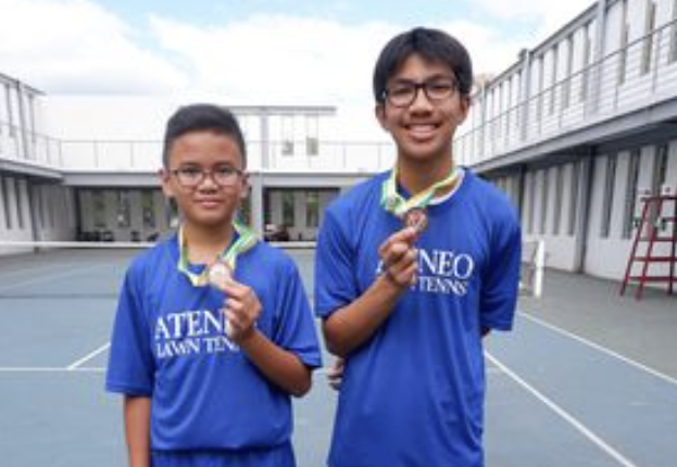 Anton Santillan & Caleb Puentespina are doubles champions of the QC Schools Lawn Tennis Division Meet 