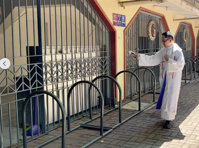 Fr Mamert Mañus SJ blesses the bicycle racks donated by Ateneo BS ME Batch ‘77