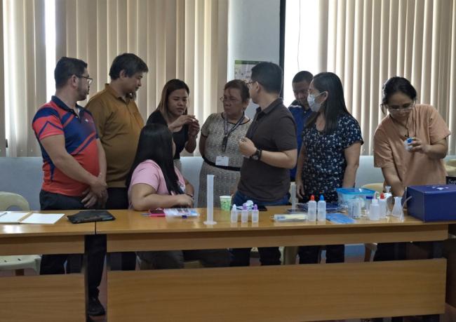 Photo: Mr. George Quitoriano and Ms. Mariela Alcaparas of AIPO presenting the Lab-in-a-box to the faculties of Xavier University