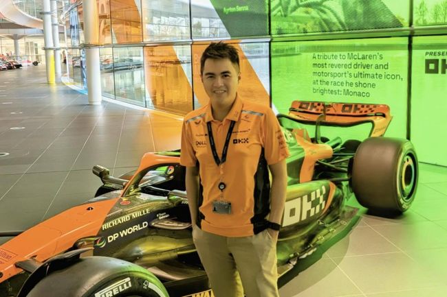 Neil Joshua Limbaga standing in front of an MCL60