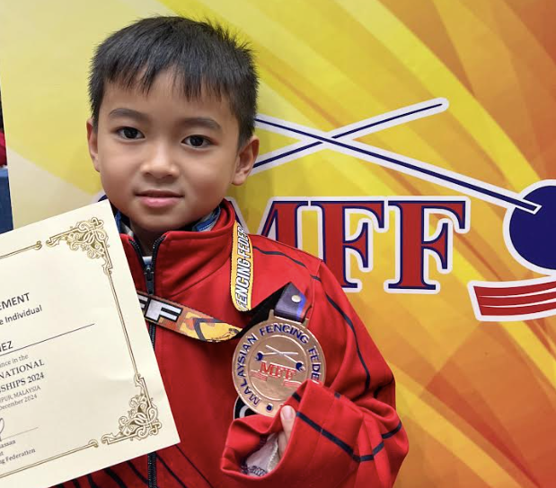  Roman Almiranez with one of 3 bronzes he won in Malaysia 