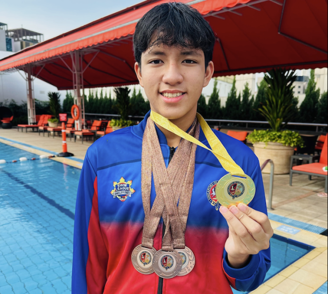 Swimmer Rafael Pablo with his medals from the 2025 SICC in Singapore 