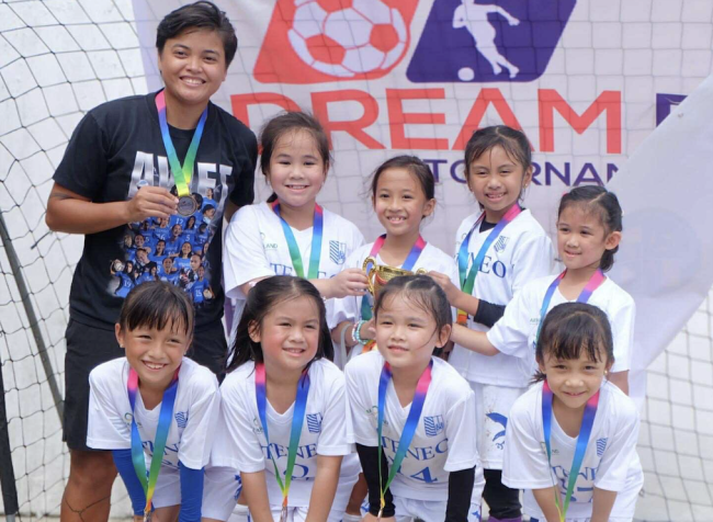 Front row from left: Tala Lorenzo, Charlie Dela Cruz, Lara Martinez, and Gabrielle Martinez; back row from left: Head Coach Joyce Semacio, Lexie Enerio, Anya Silva, Cassiegh Abad, Mia Sto. Domingo
