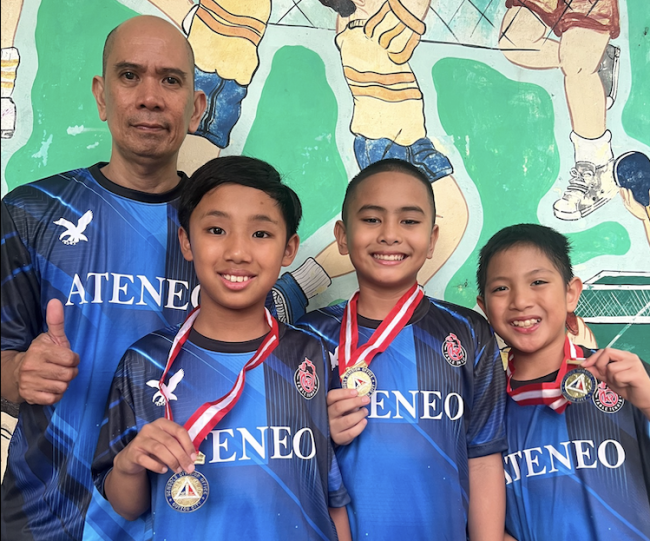 (L–R) Coach Leo Raymundo, Philo Go, Titus Pachica, and Karl Guanio will represent Quezon City as part of the NCR Table Tennis Team at the 2026 Palarong Pambansa.
