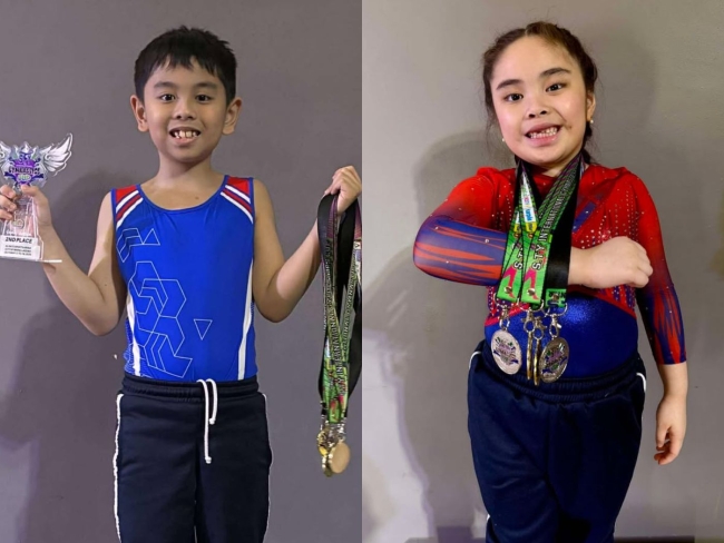 Joe Mendoza and Charlotte Saluta posing with their awards