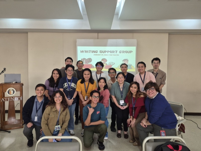 The writing support group gathers for a photo