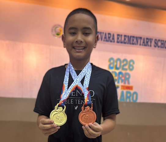 Titus Pachica  with his gold and bronze medals from the NCR Palaro Meet