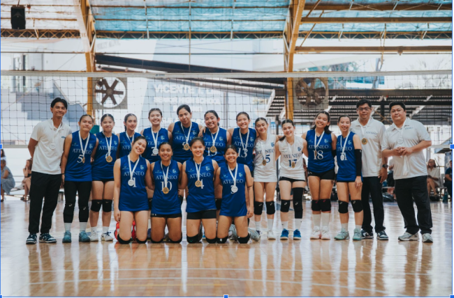 Front row kneeling from left: Gian Damian, Jelena Dait, Luanne Atienza, and Ysa Gomez; back row standing from left: Asst. Coach Diego Avila, Jona Ajon, Irene Yaranon, Ainsly Santiago, Julia Mariano, Margaux Viola, Chessca Malabanan, Aubrey Tay, Thistle Chebat, Jem Ty, Sabine Tomanan, Luisa Del Prado, Coach Franz Damian, and Coach Jay Regala